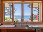 Appreciate a fantastic view of the Pacific Ocean while doing dishes at the stainless steel sink.
